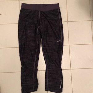 Nike Dri-Fit Capri Tights. Purple. Zipper in back is broken